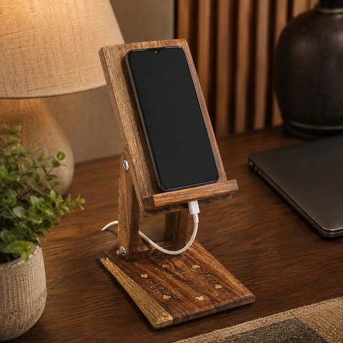 Handcrafted wooden phone stand with smartphone on office desk